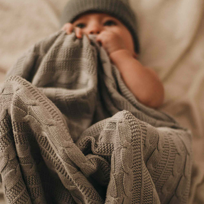 A baby feels safe and comfortable when wrapped in the right organic blanket, whether it be cotton, muslin, merino wool, or bamboo.